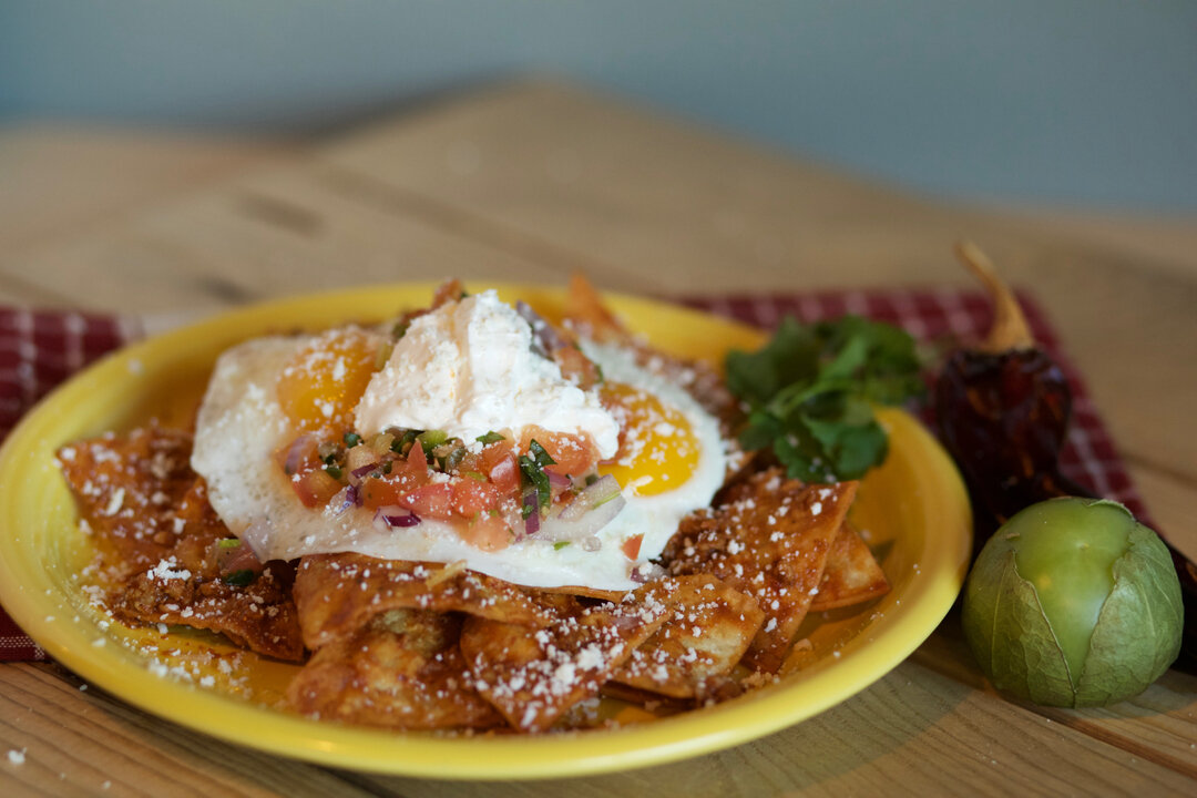 Kick off your Cinco de Mayo celebrations with a hot plate of Chilaquiles! Two eggs any style, pico de gallo, sour cream and cotija cheese served over tortilla chips tossed in a house ancho chili sauce!