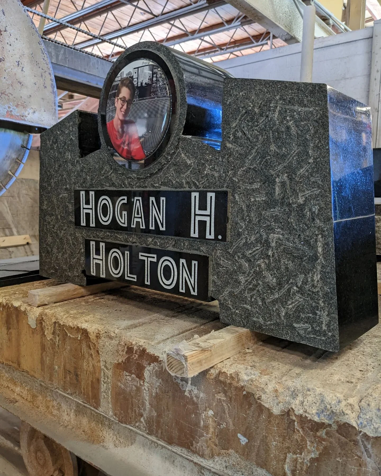 This is the cap piece for a very unique memorial for a young man.  Can you guess the theme for memorial.  Hint: the answer is in the font.