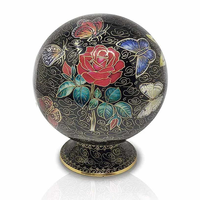 Decorative round urn for ashes with butterflies, rose, and black background