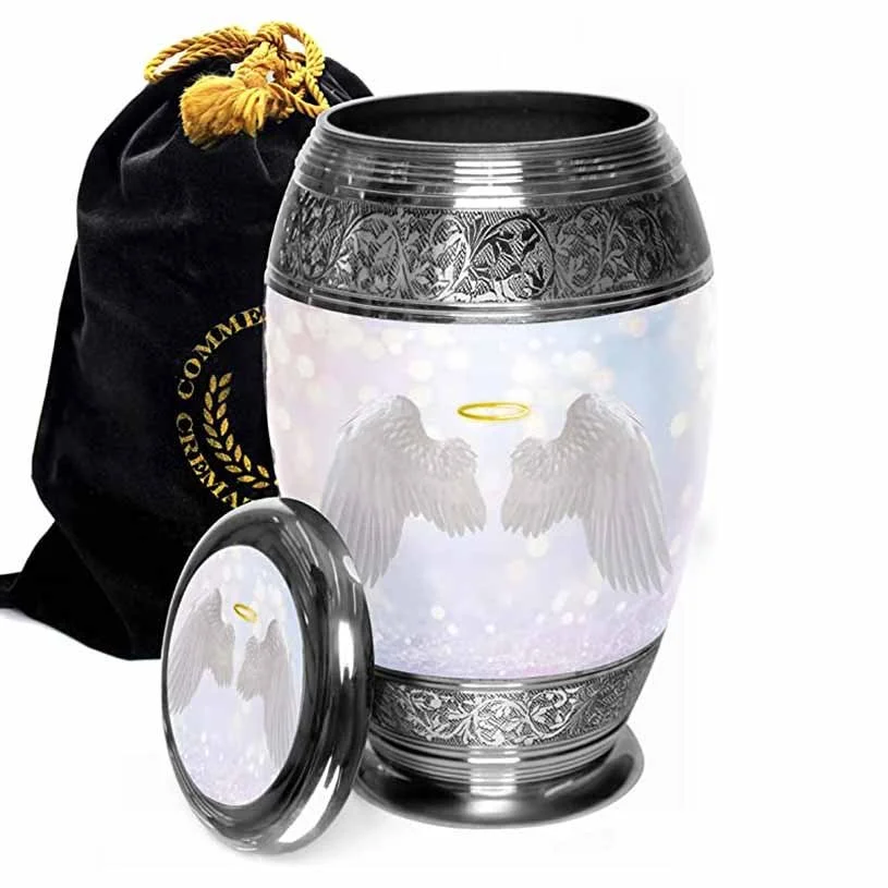 A decorative silver urn with picture of angel wings