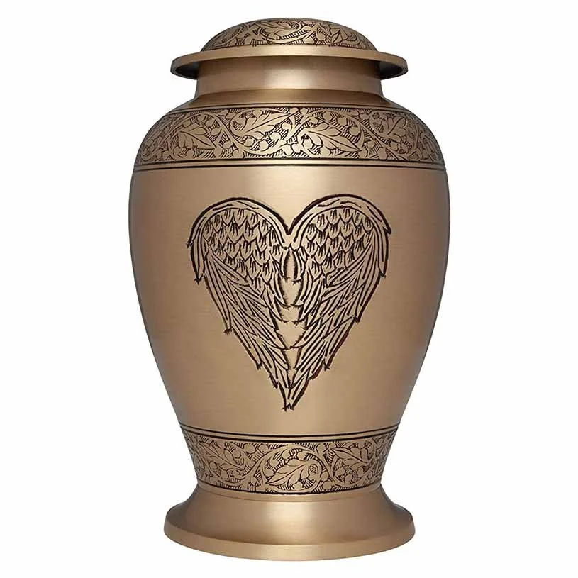 Brass cremation urn with wings shaped like a heart