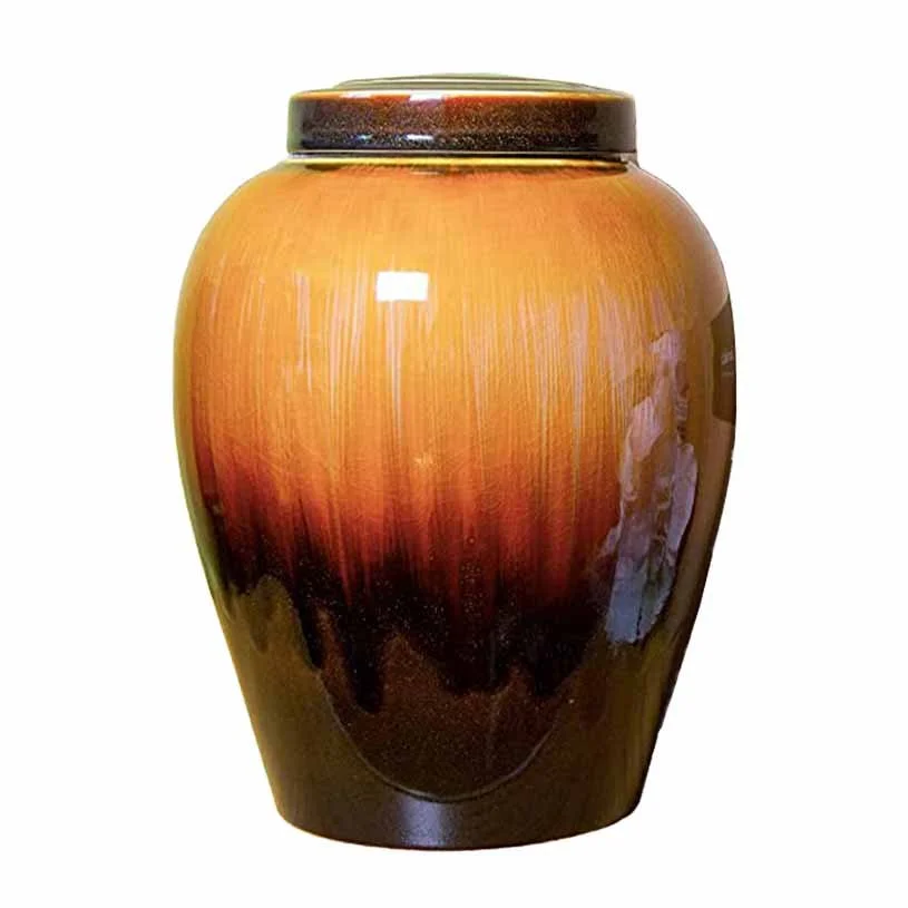 Ceramic cremation urn for human ashes with brown sunset glaze