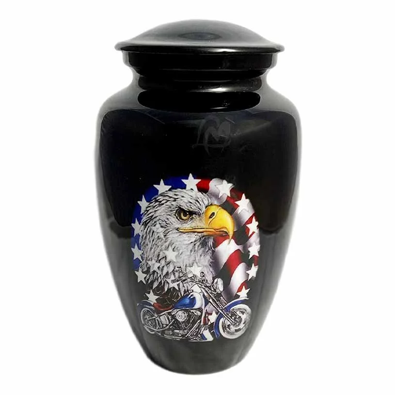 A black urn for human ashes with a motorcycle, bald eagle and american flag