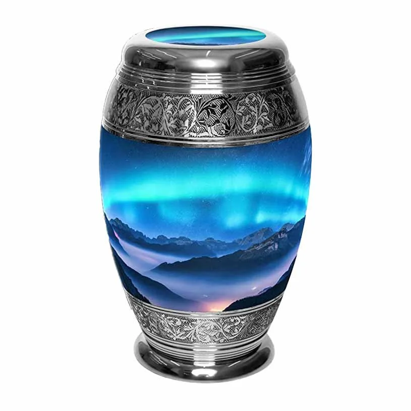 A silver decorative urn for human ashes with a picture of the aurora borealis