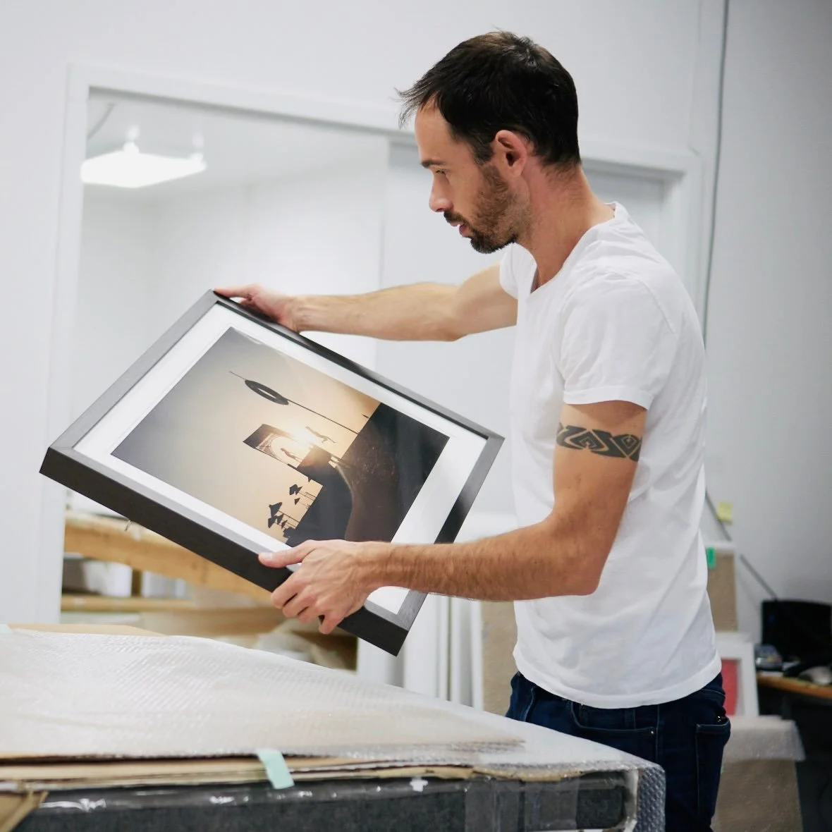 The final visual inspection of a custom-framed artwork is one of the most important steps in producing my work.

Once a print has been personally signed and numbered by me, it is either prepared as a print-only artwork or completed as a fully framed,