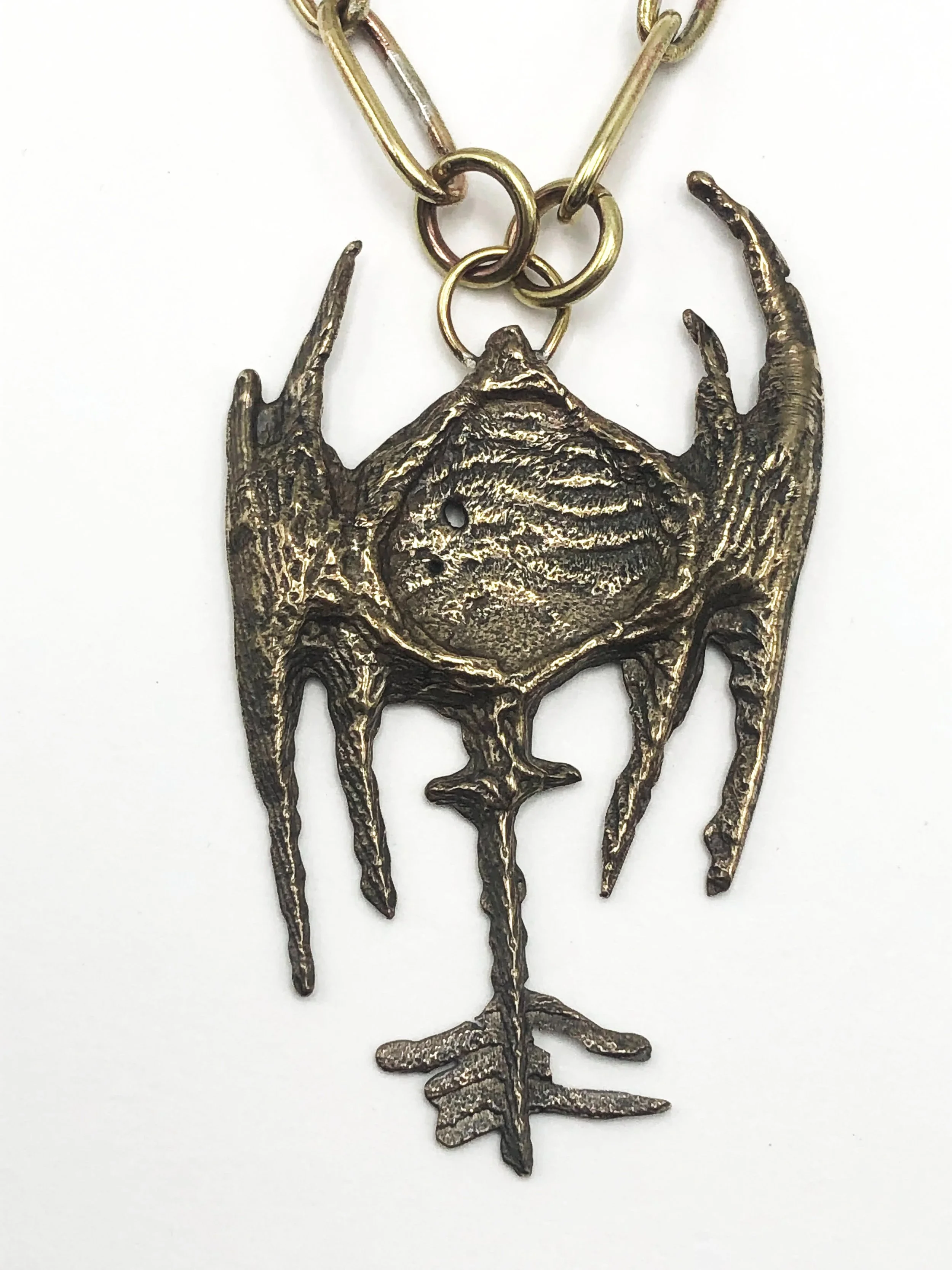 Pendant. 2021. Bronze, brass chain. 