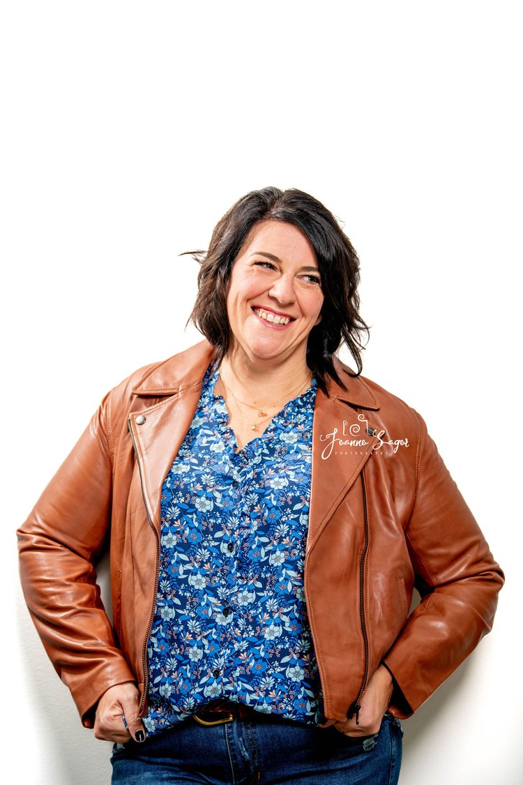 a headshot of a woman smiling during her branding photo session
