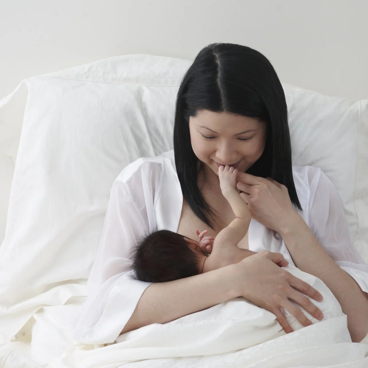 Mom-kissing-baby-hand.jpg
