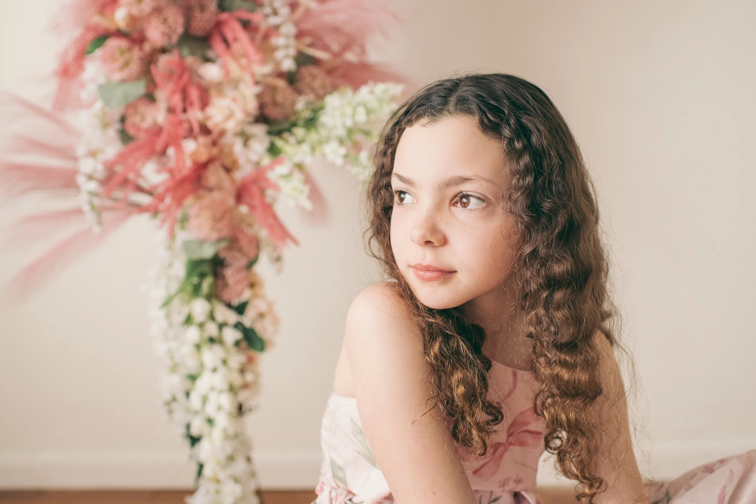 image of young girl with a floral background