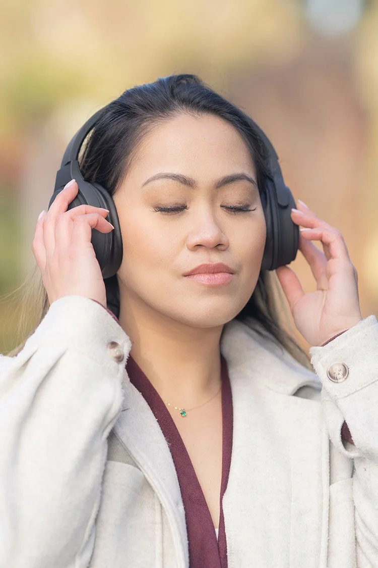 Lifestyle portrait of woman wearing headphones