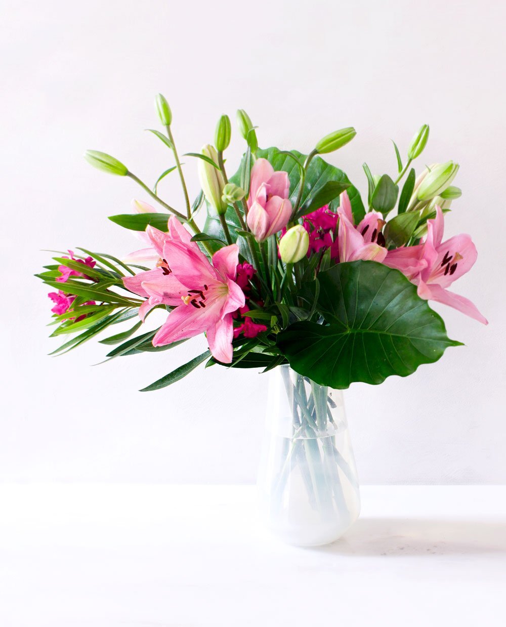 Flower Arrangement DIY - Line Your Vase With Leaves To Hide The Flower Stems