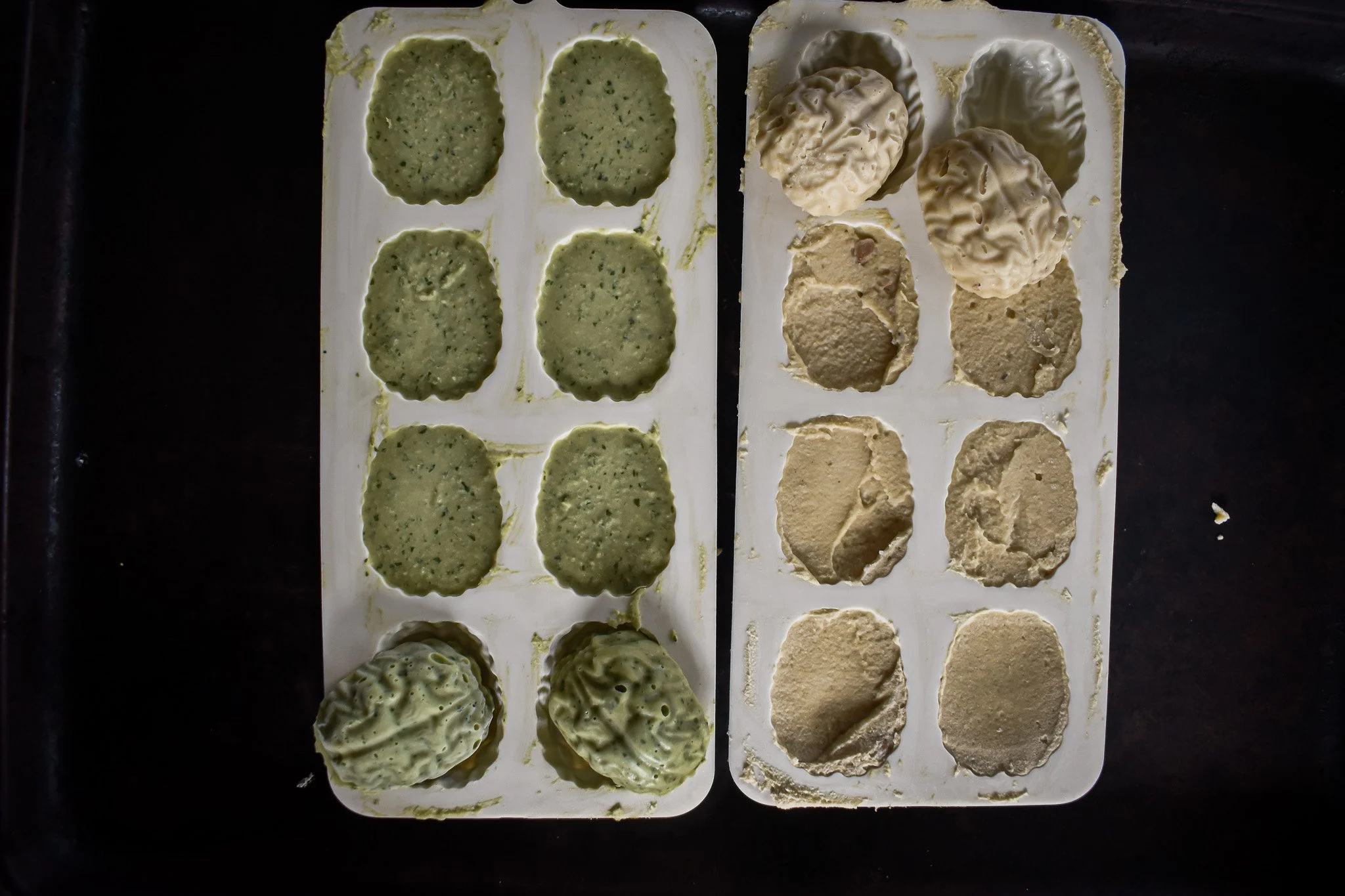 overhead view of silicone molds with frozen hummus