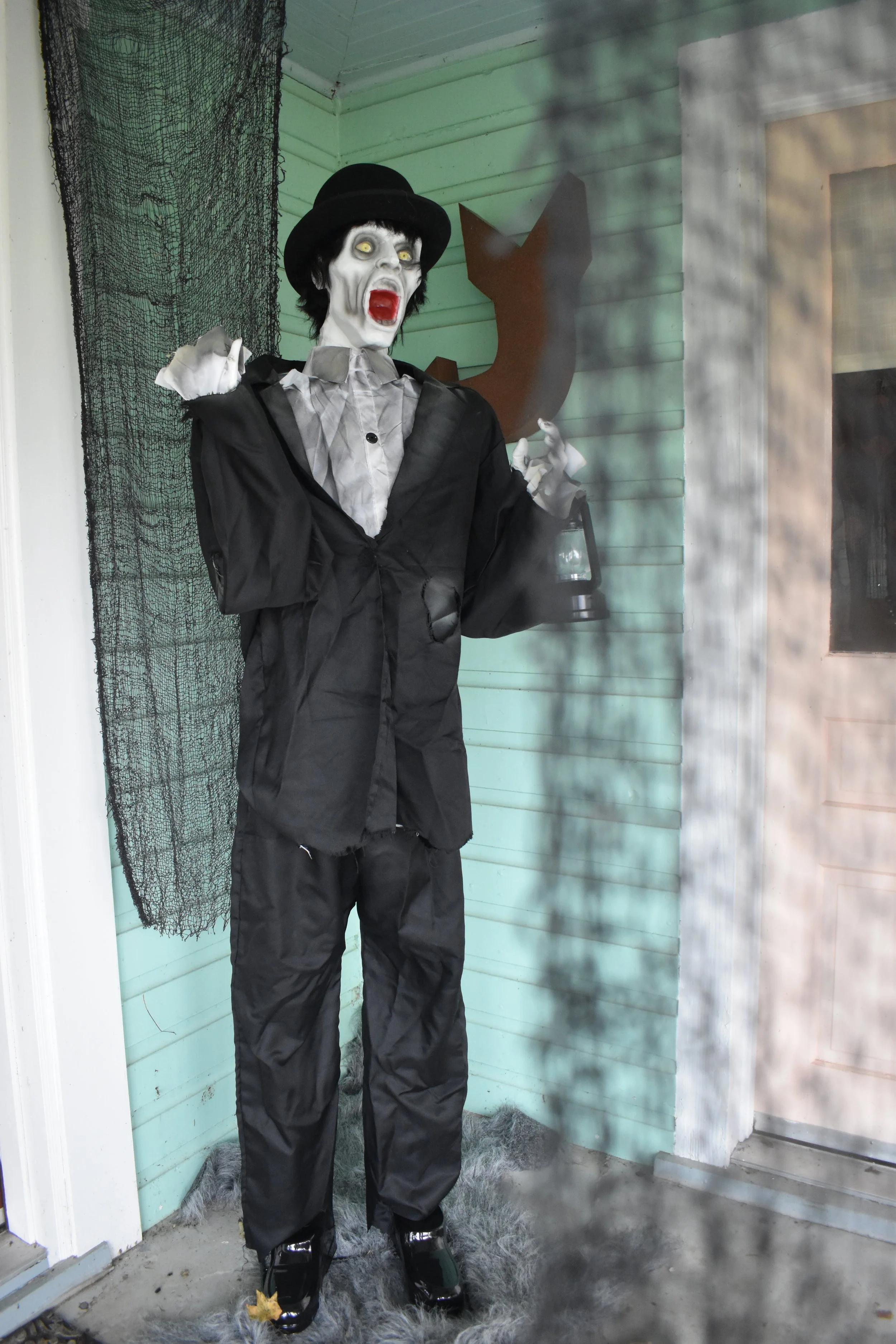 zombie prop surrounded by hanging creepy cloth