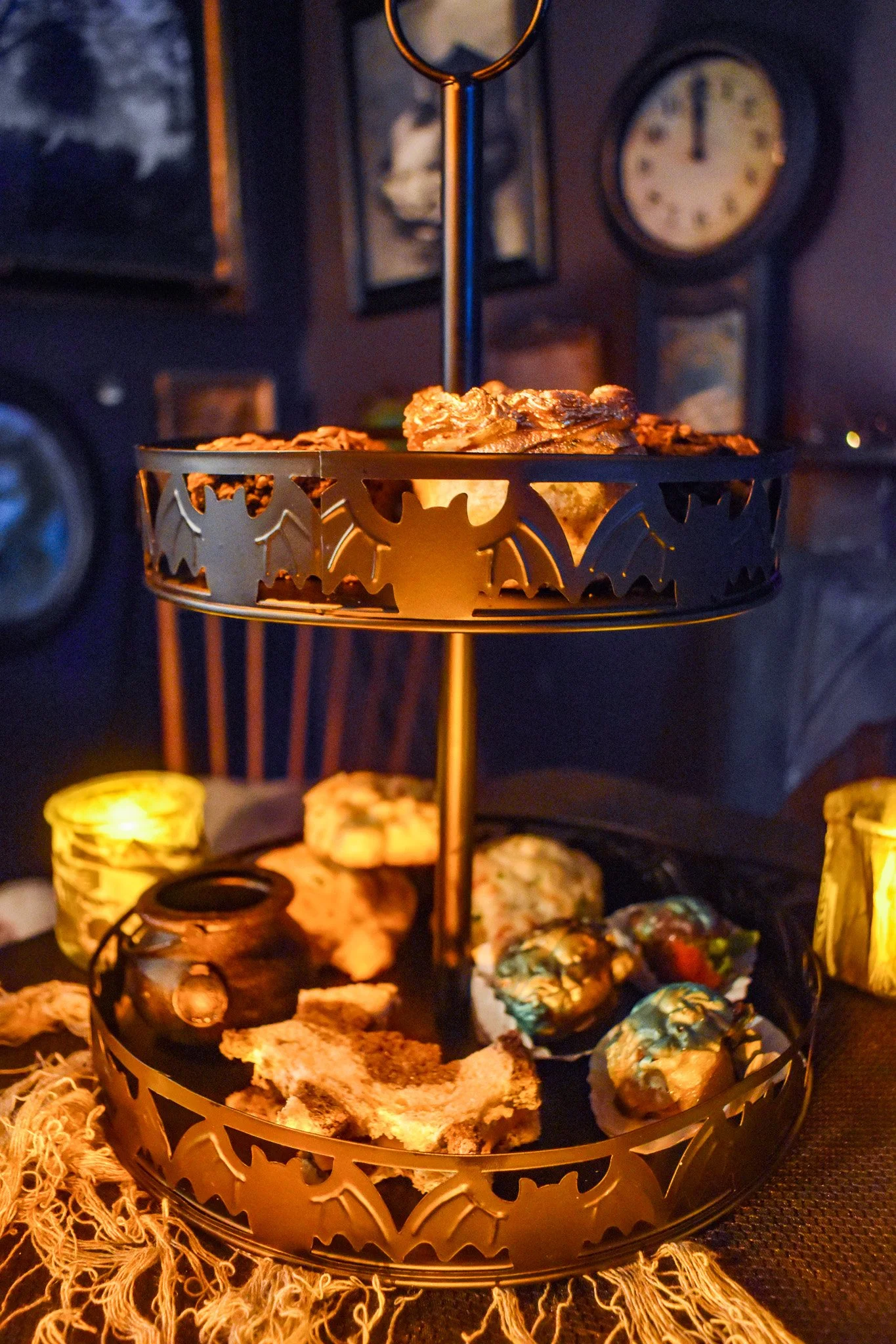 Tiered tray with tea cakes and sandwiches