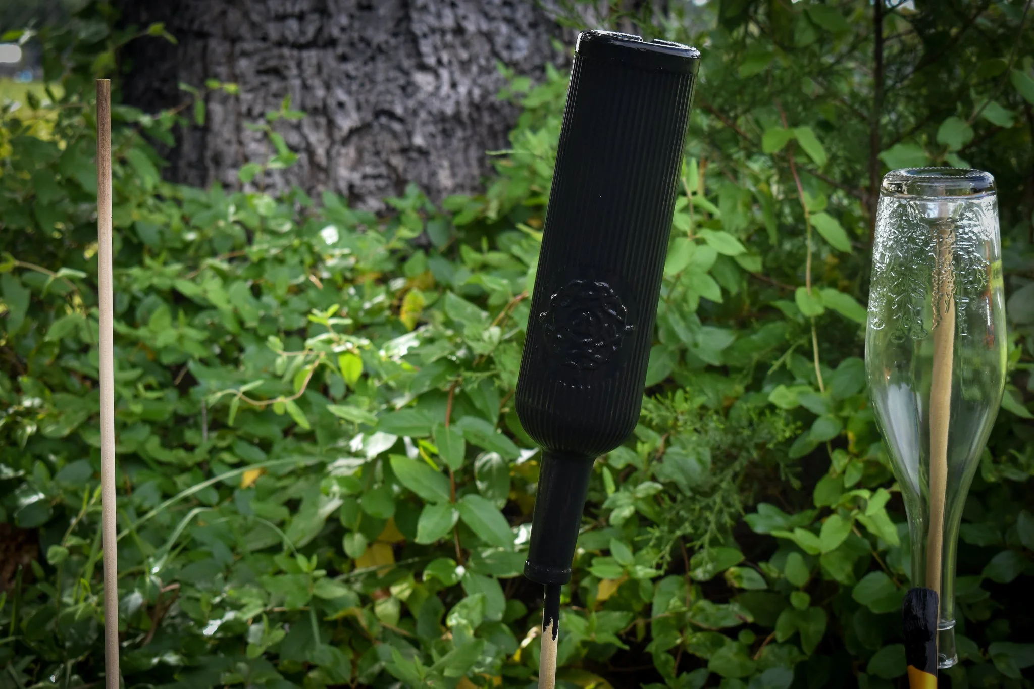 wine bottles upside down on wooden dowels