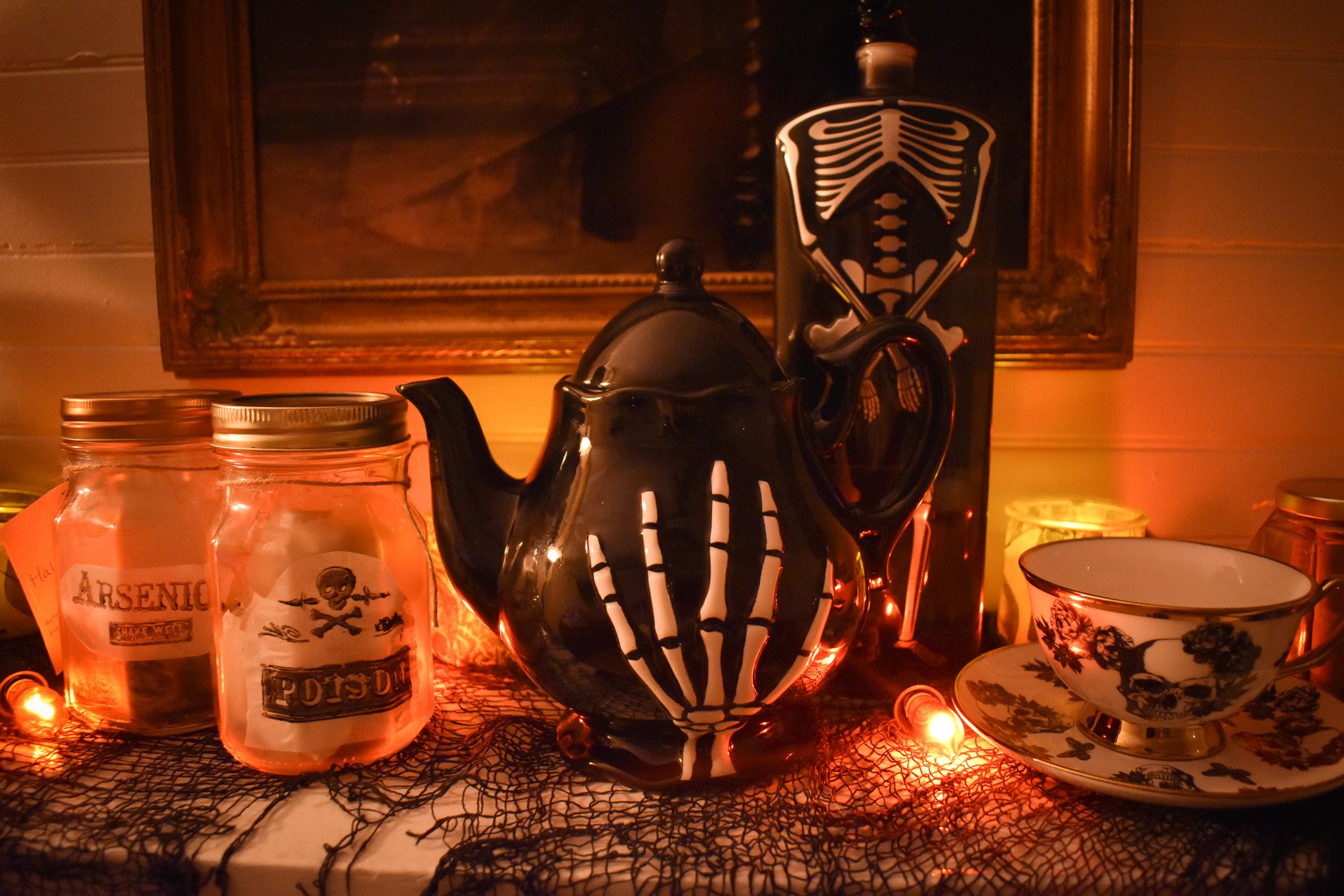 Tea pot with a skeleton hand