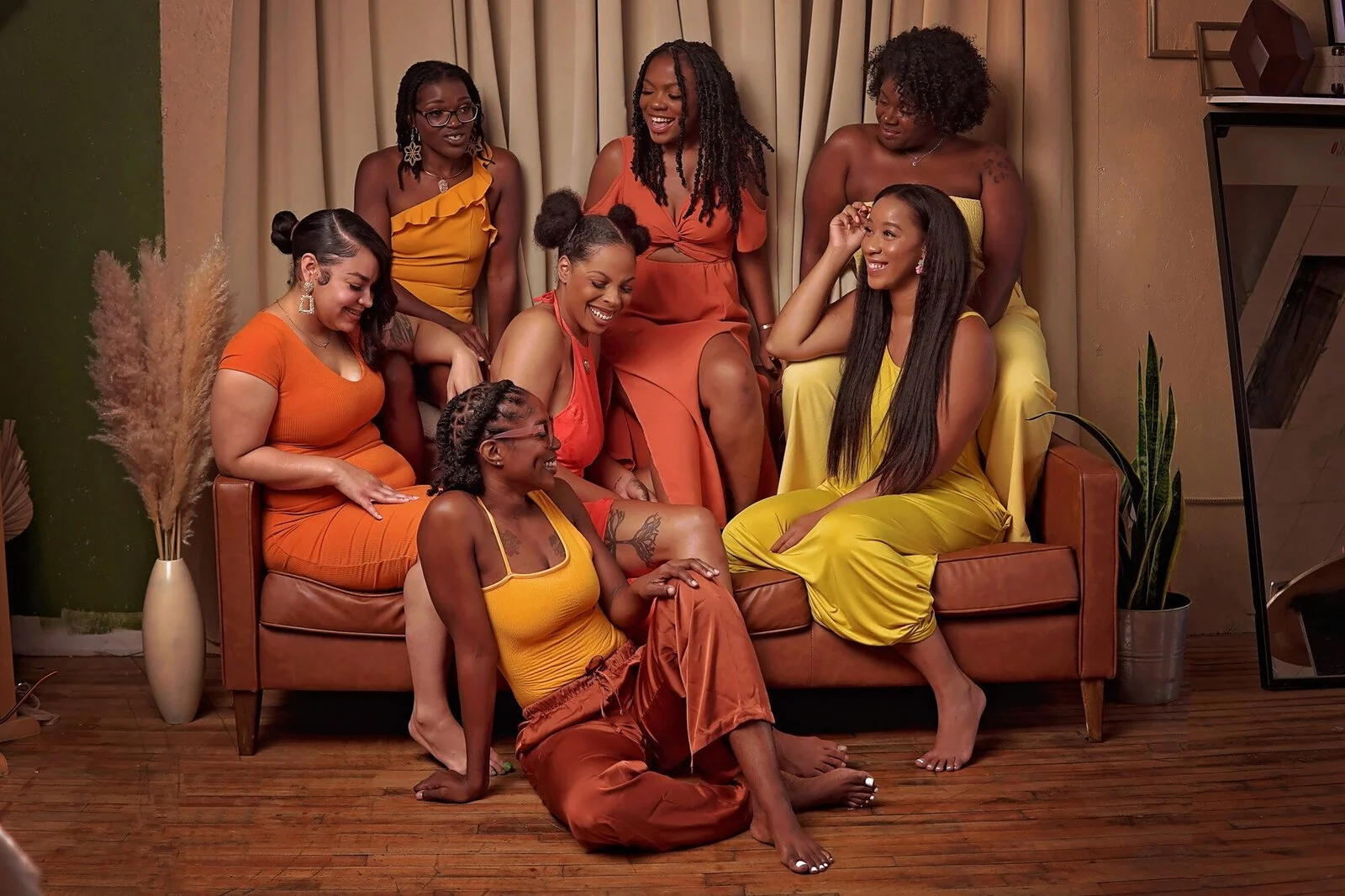 Group of doulas laughing and connecting with each other.