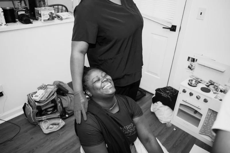 Midwife laughing and smiling.