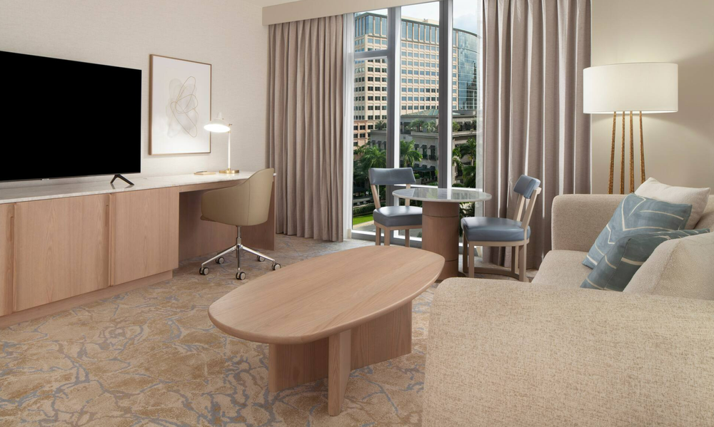  Modern hotel interiors inside Hilton West Palm’s executive floor suites with custom furniture crafted by Artco Hospitality Furnishings. 