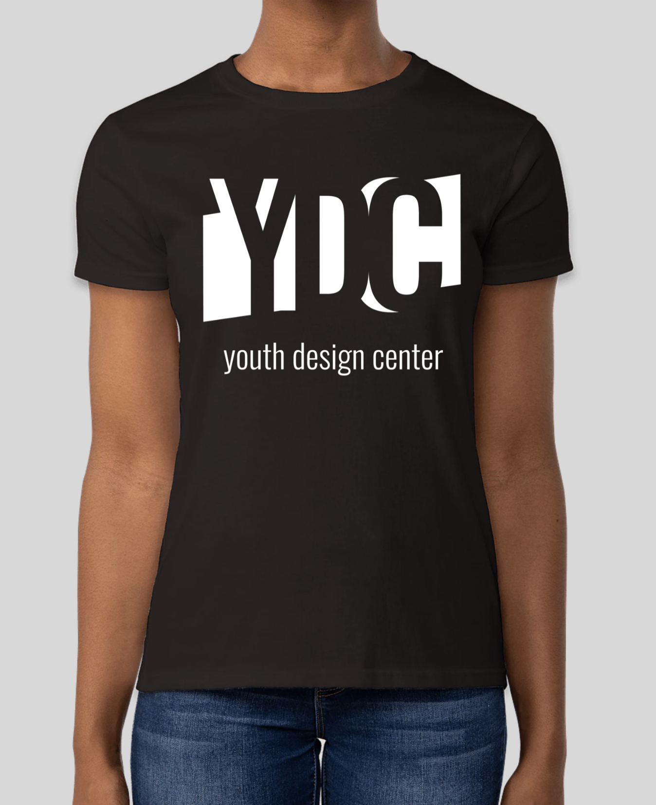 Black T-shirt featuring the white Youth Design Center logo on the front