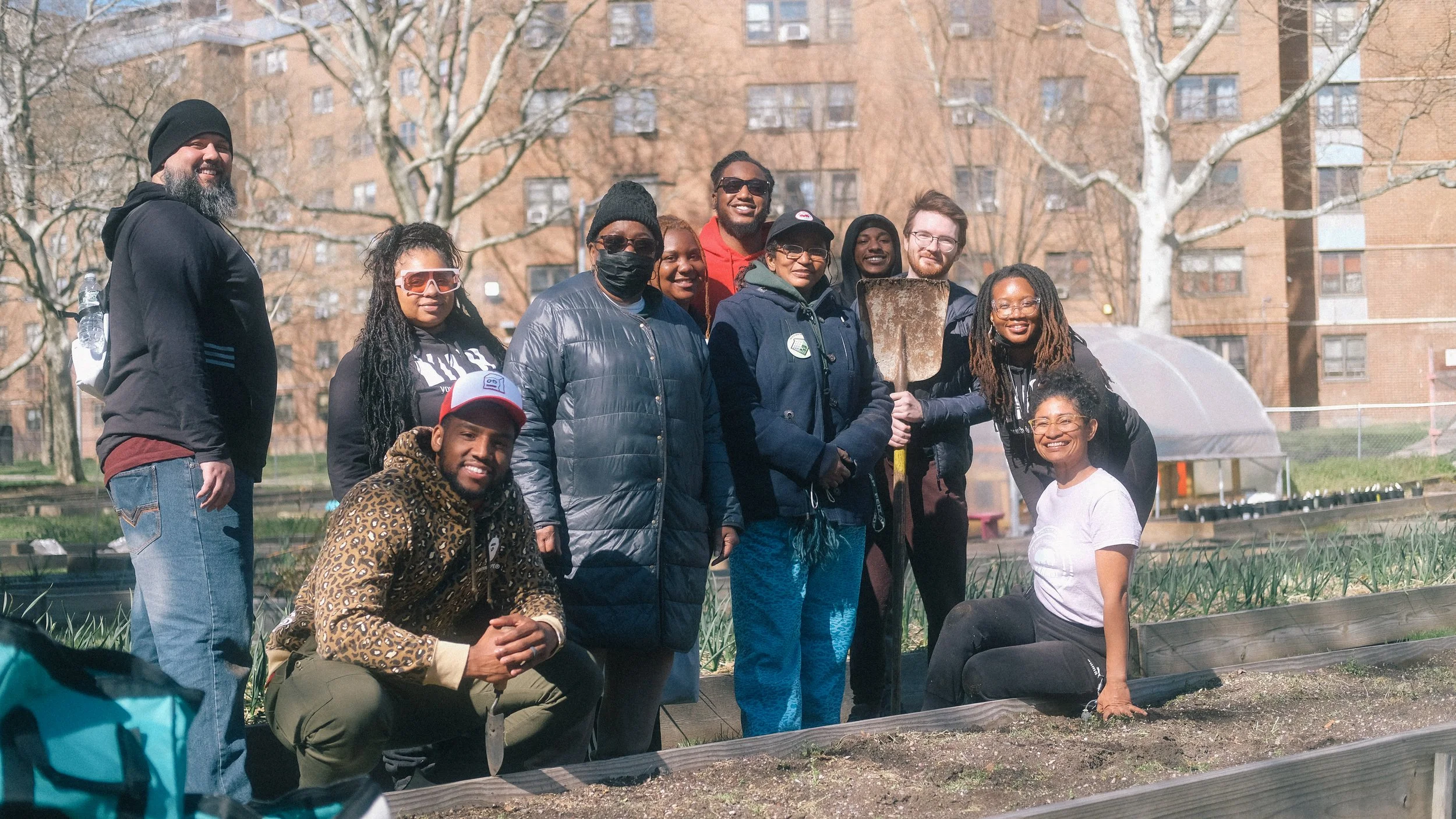 group photo of YDC staff with ENY Farms after cleaning and replanting a local garden in brooklyn