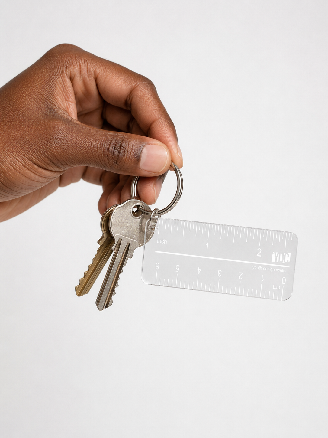 Clear acrylic Youth Design Center ruler keychain with inch and centimeter markings