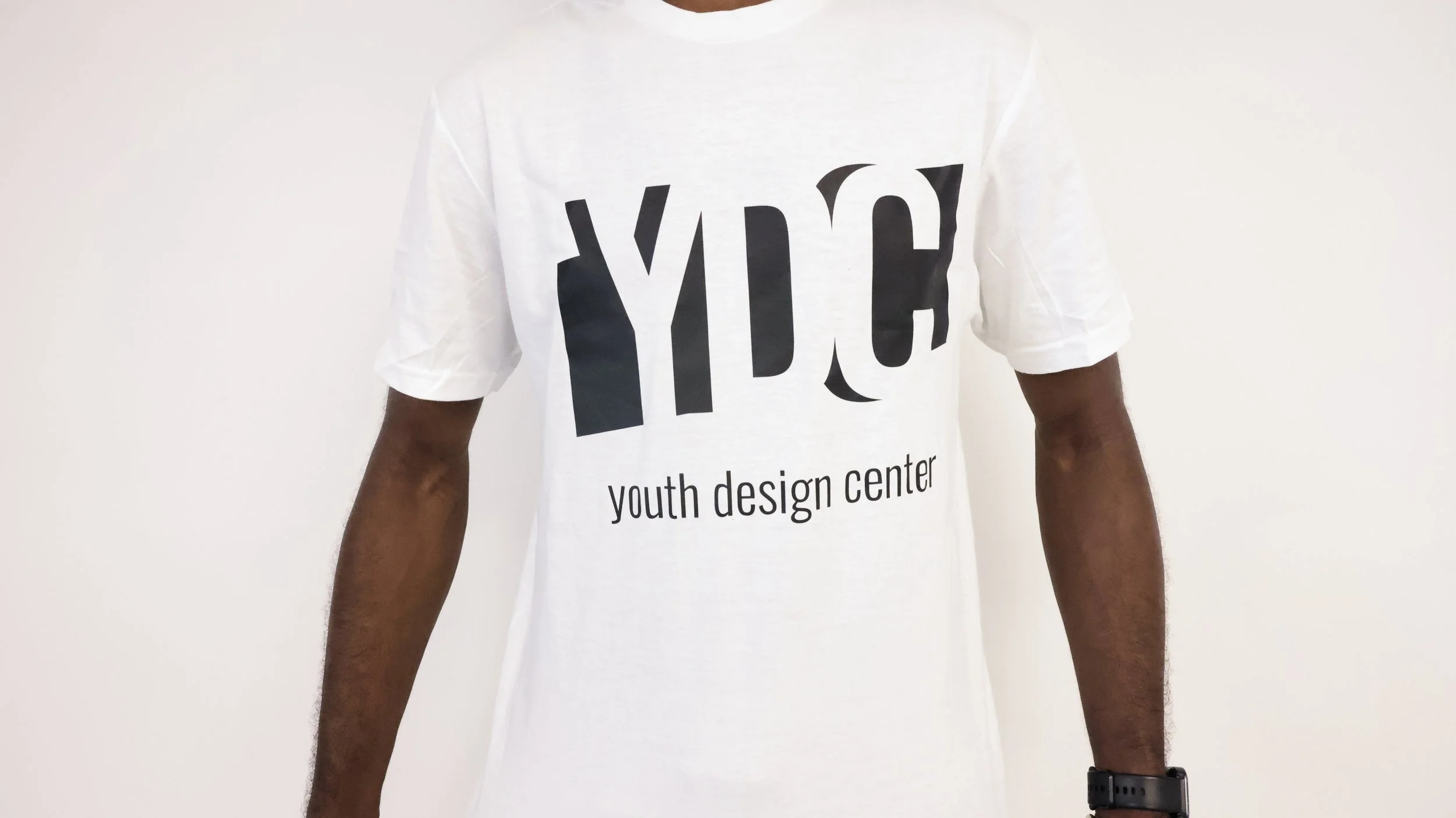 White T-shirt featuring the black Youth Design Center logo on the front