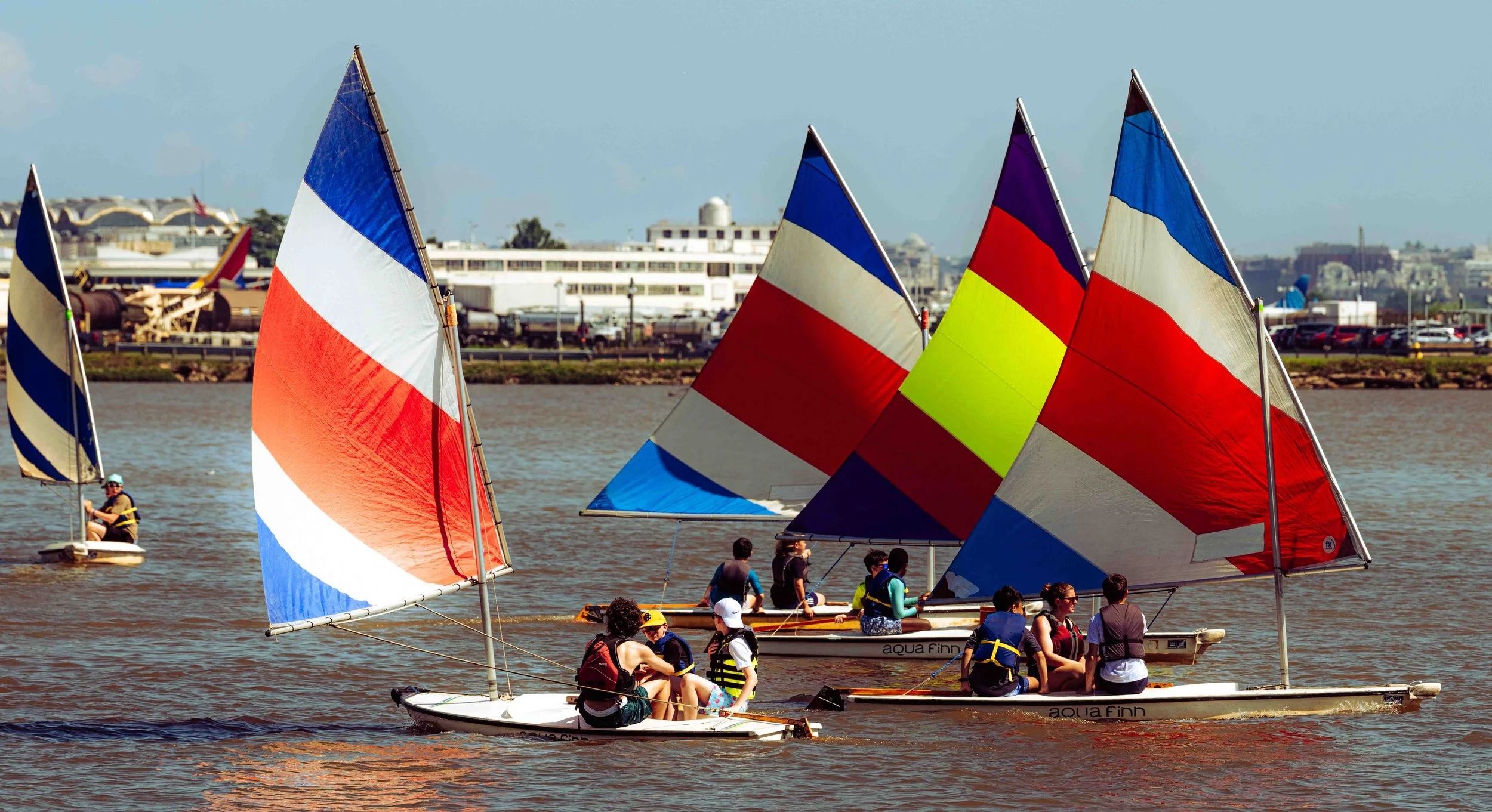 Young sailors learn teamwork and boat handling during a training session on the Potomac.