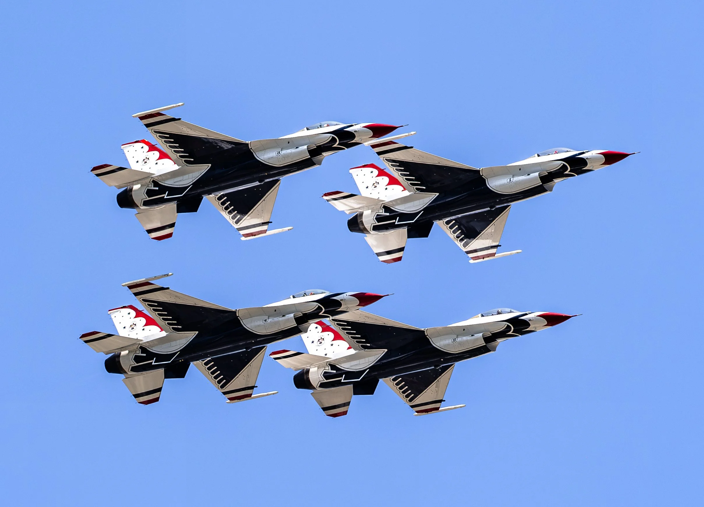 The U.S. Air Force Thunderbirds fly in tight diamond formation during the America 250 aerial demonstration over Washington, D.C.