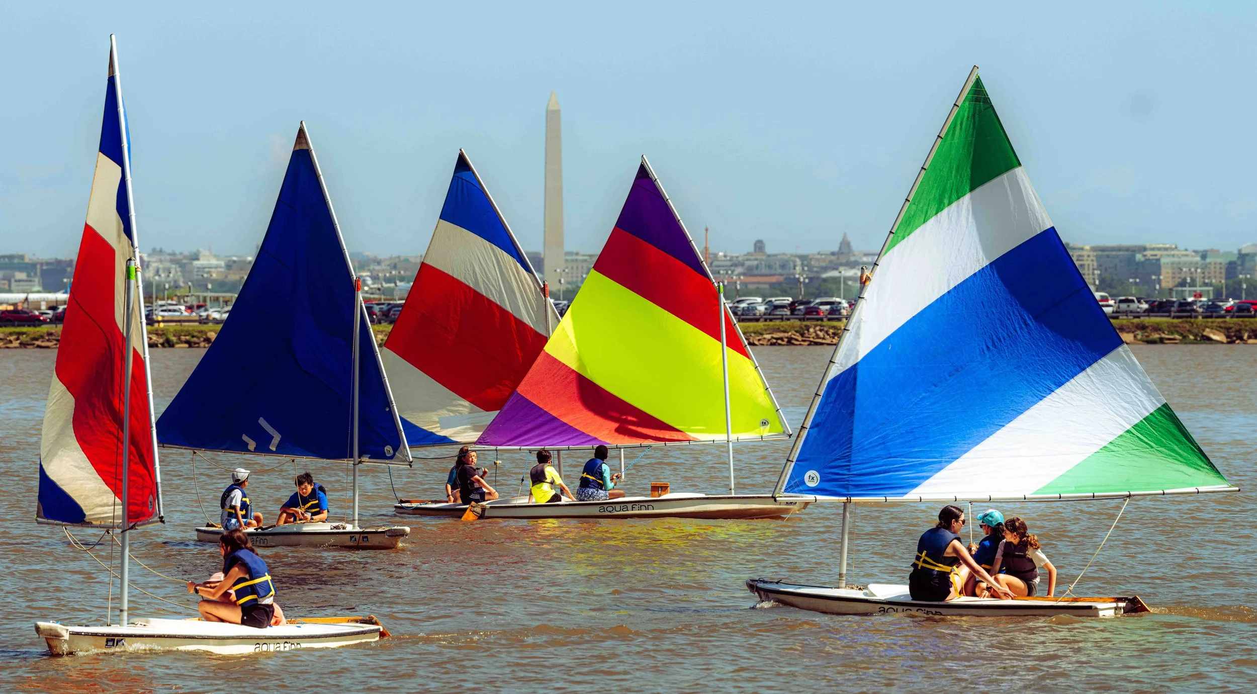 Student sailors practice boat handling and sail control on the waters of the Potomac River.