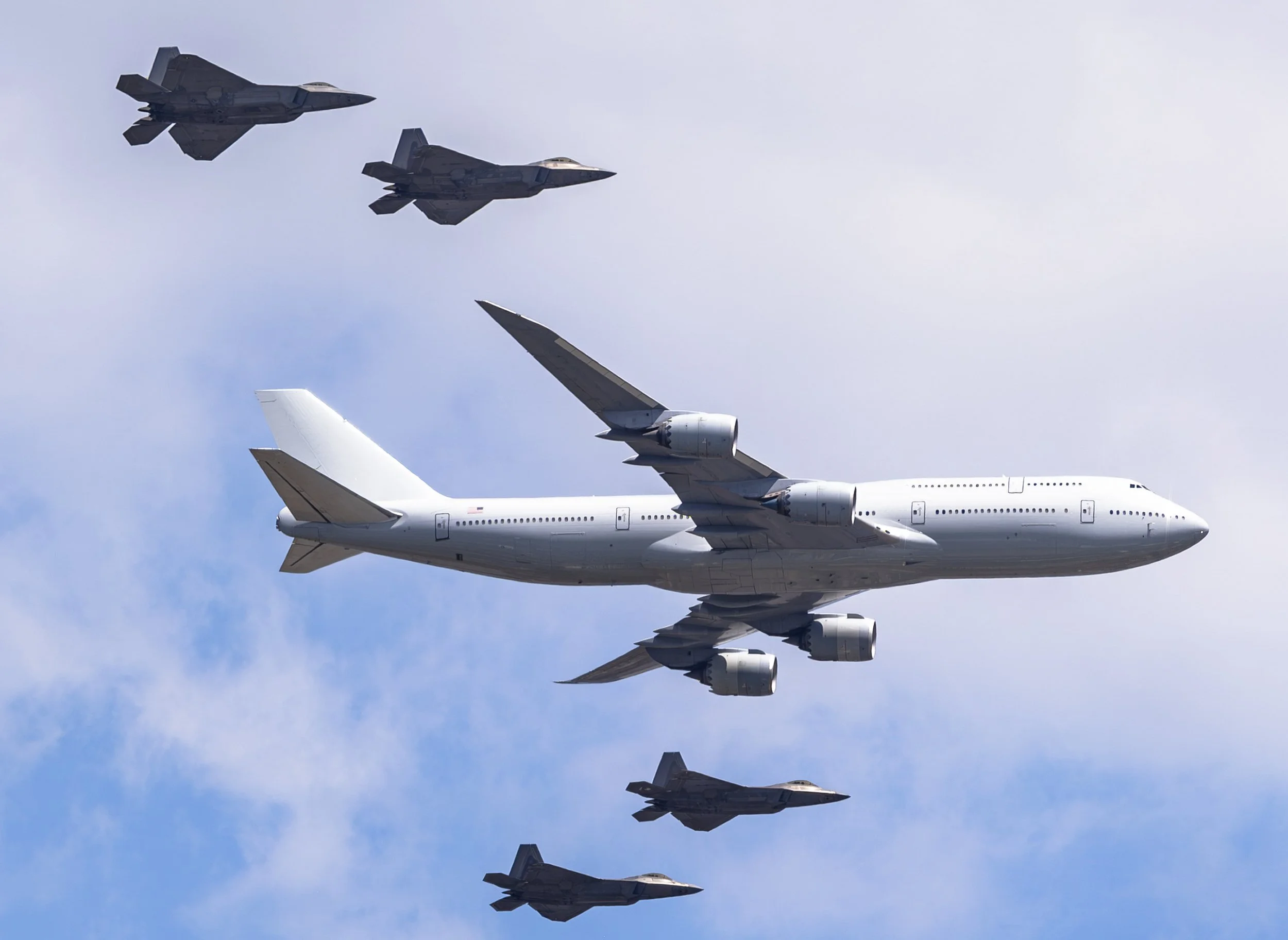 Military fighters escort the new Air Force One, Boeing 747 over Washington, D.C. during a historic heritage flyover honoring America's aviation legacy.