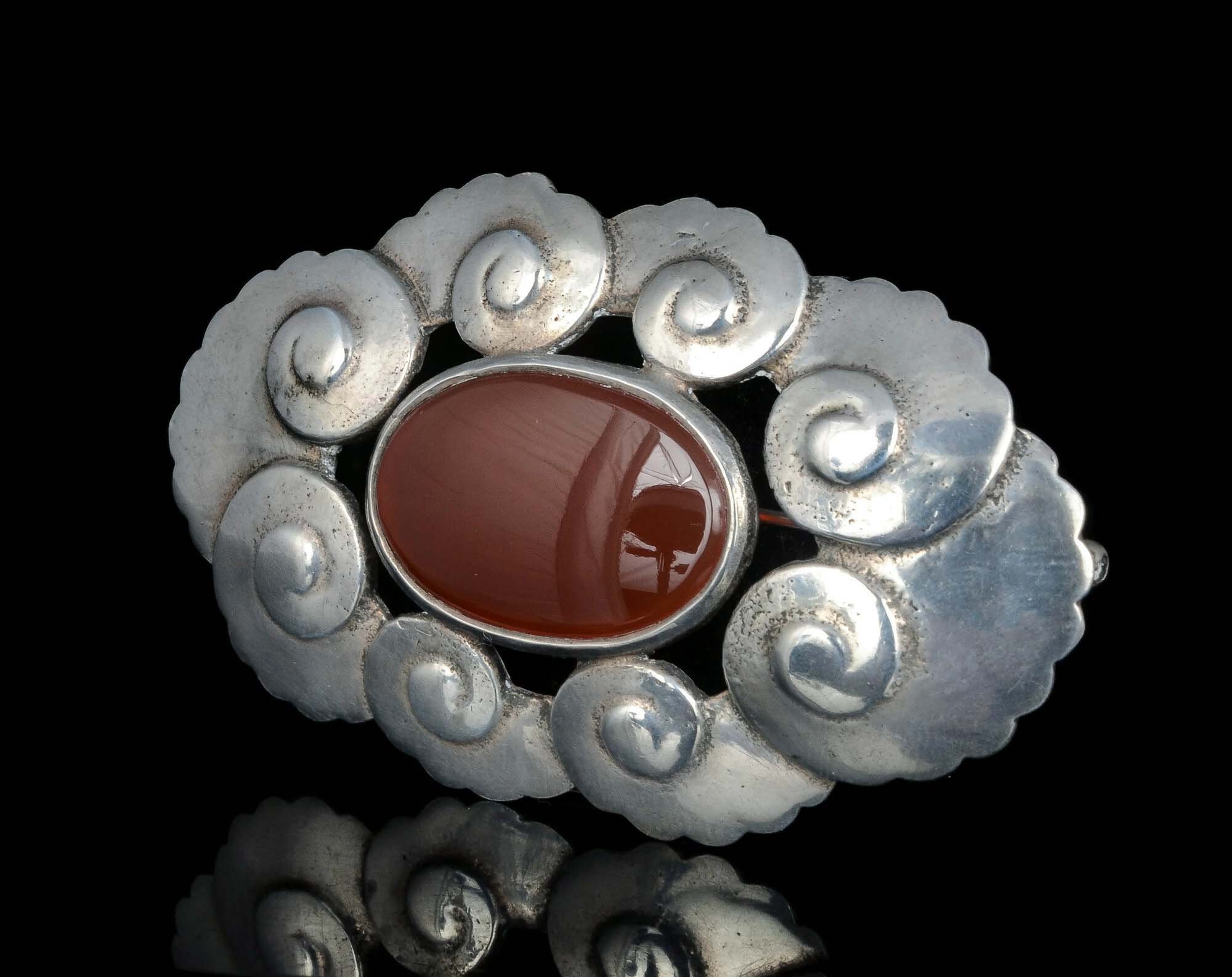 Arts and Crafts silver and carnelian nautilus Brooch