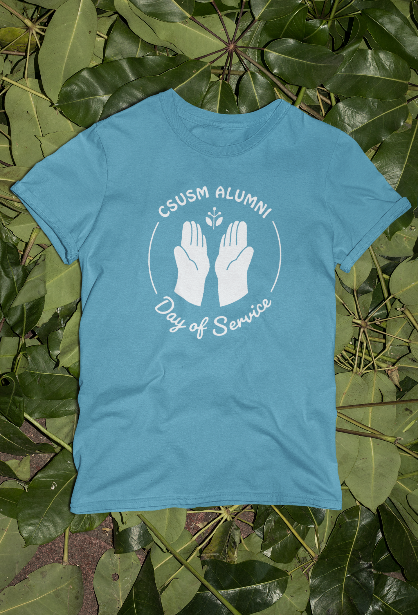 mockup-of-a-tie-dye-t-shirt-flat-laid-over-green-leaves-m4033.png