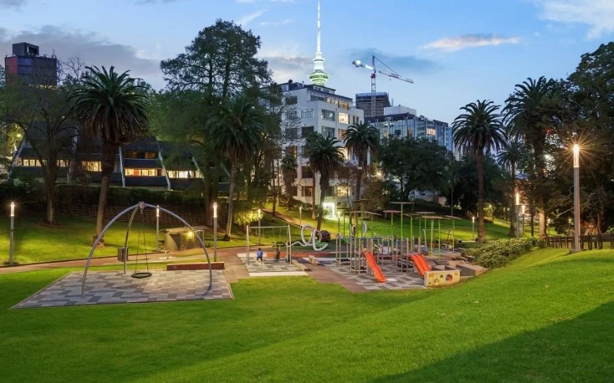 A children's playground in the evening.