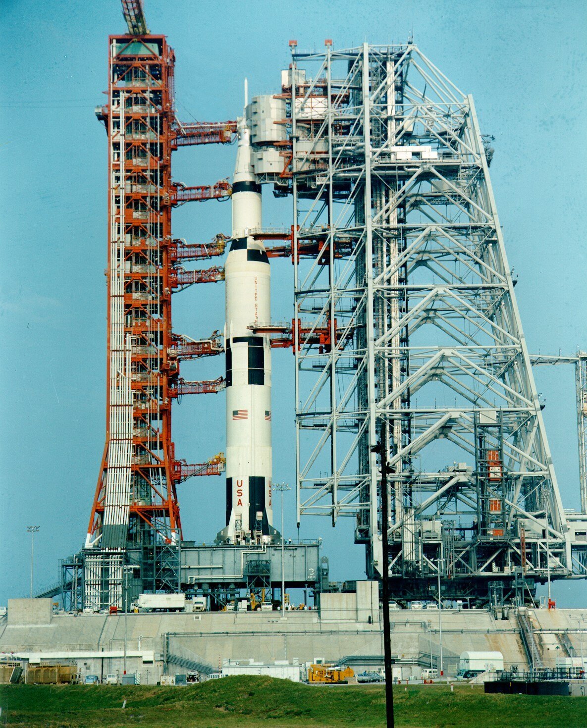 The Mobile Service Structure (right) in use to prepare the Apollo 16 Saturn Rocket for launch.