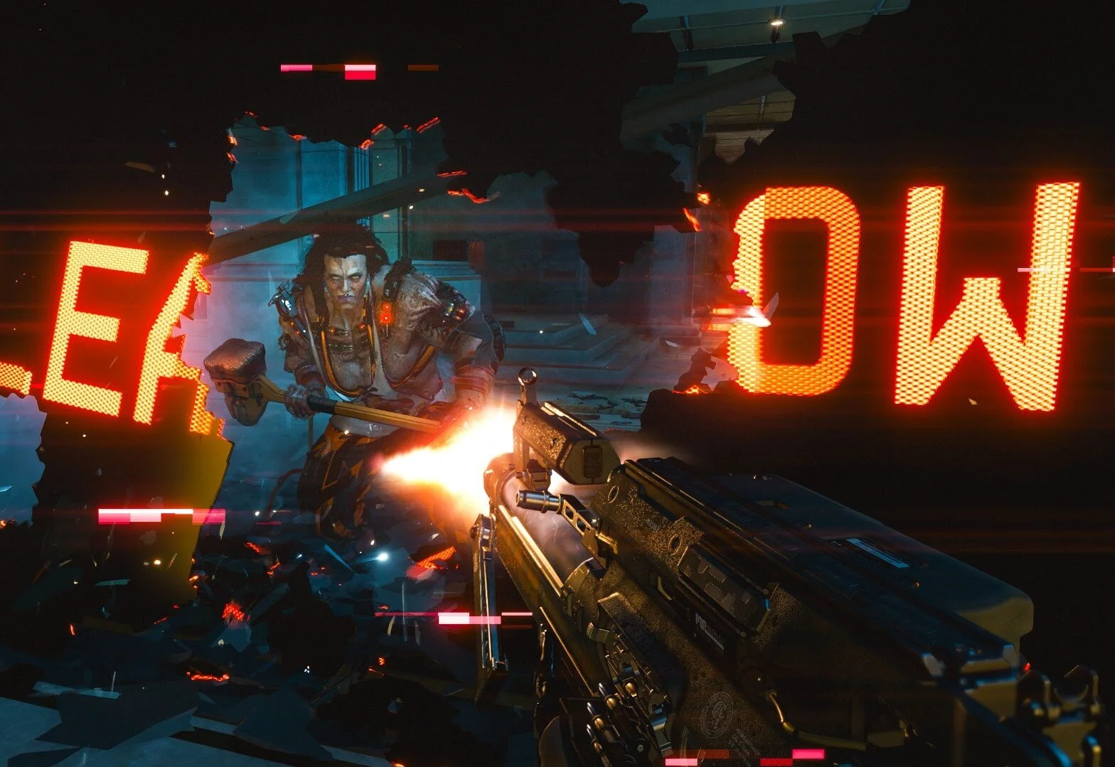 The leader of The Animals gang, Sasquatch, breaks through a barrier into gunfire