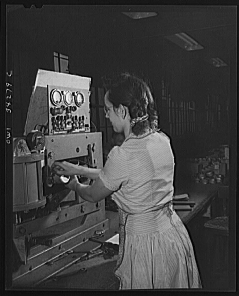 A girl at the Fafnir Bearing Company testing bomb shackles1.jpg