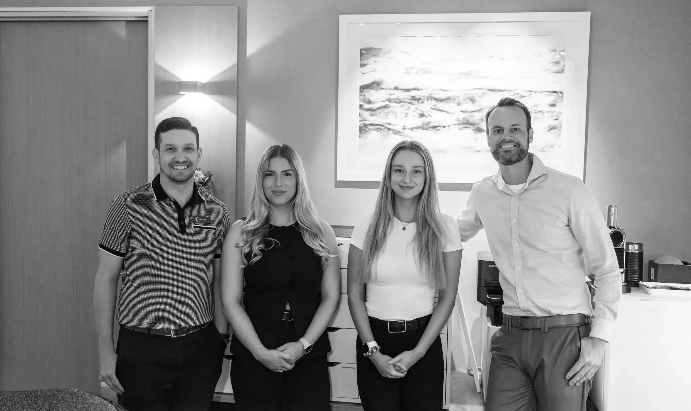 Founders Dion Hulshoff and Aidan Torpy standing in the Somnocare Perth Sleep Clinic office reception with 2 women in the Somnocare team.