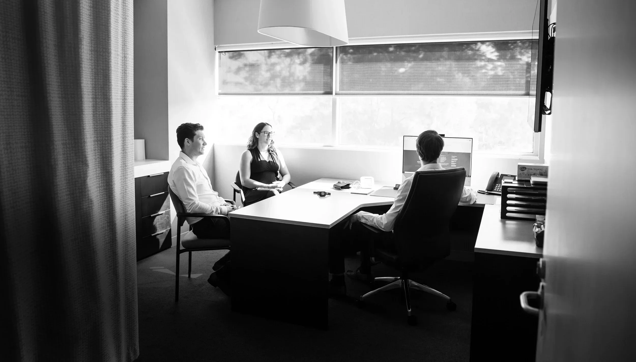 Sleep Scientists Dion Hulshoff and Aidan Torpy sitting in one of the Somnocare Perth Sleep Clinic offices having a meeting