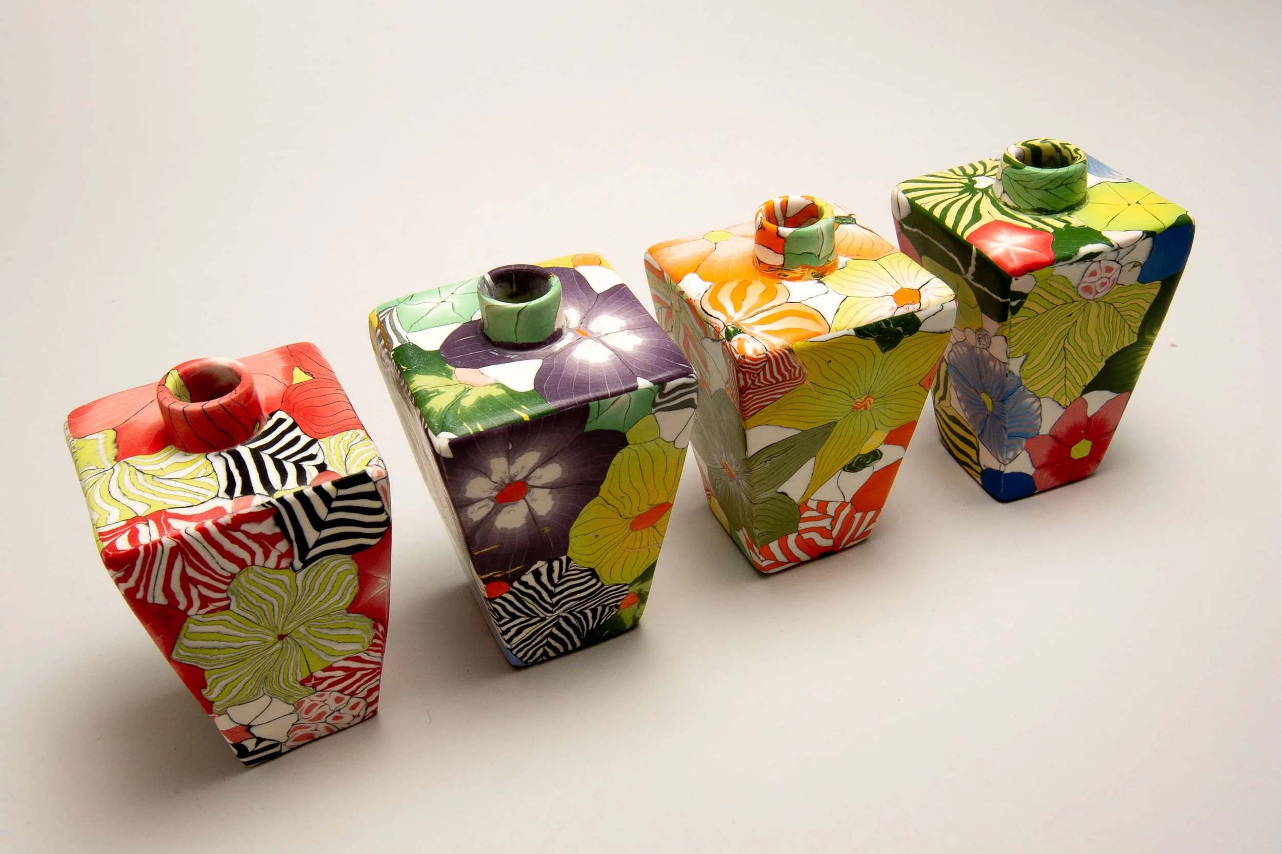 Small tapered Nerikomi vases
 
 Coloured porcelain 
 6 x 10 cms 
 Sold 