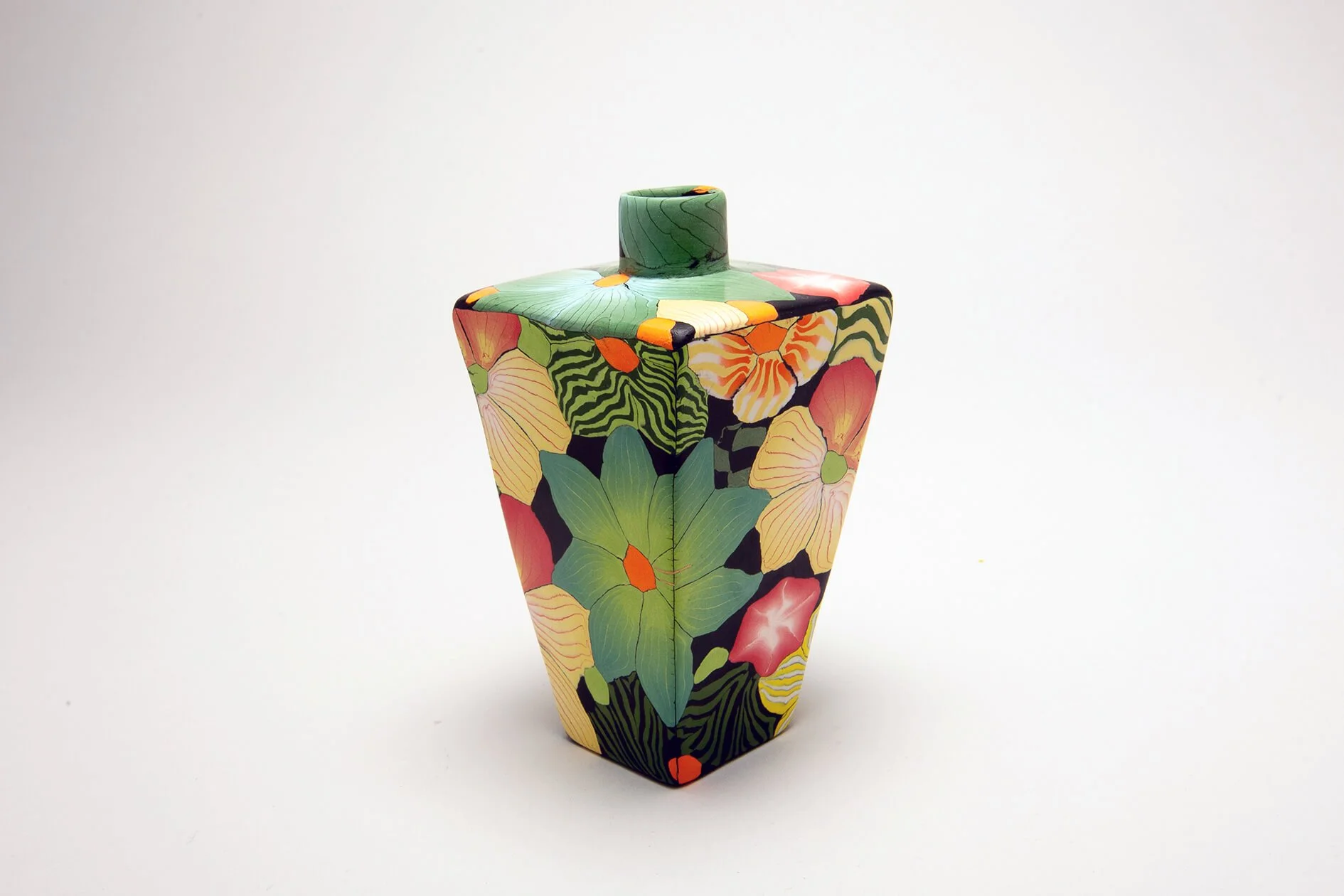 Small tapered Nerikomi vase
 
 Coloured porcelain 
 6 x 11 cms 
 Sold 