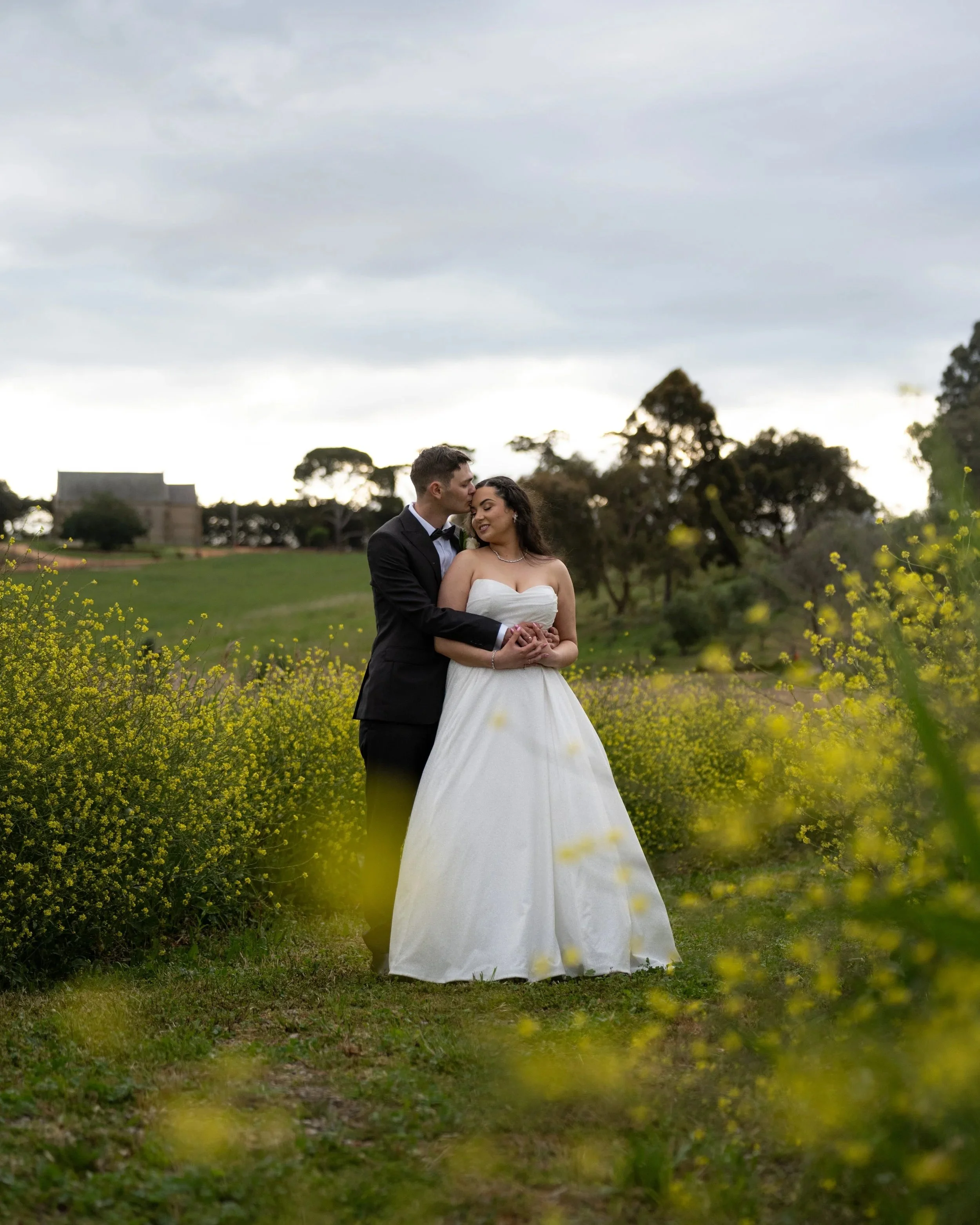 A bride and grrom holding hands in a maze outside of Geelong, Victoria