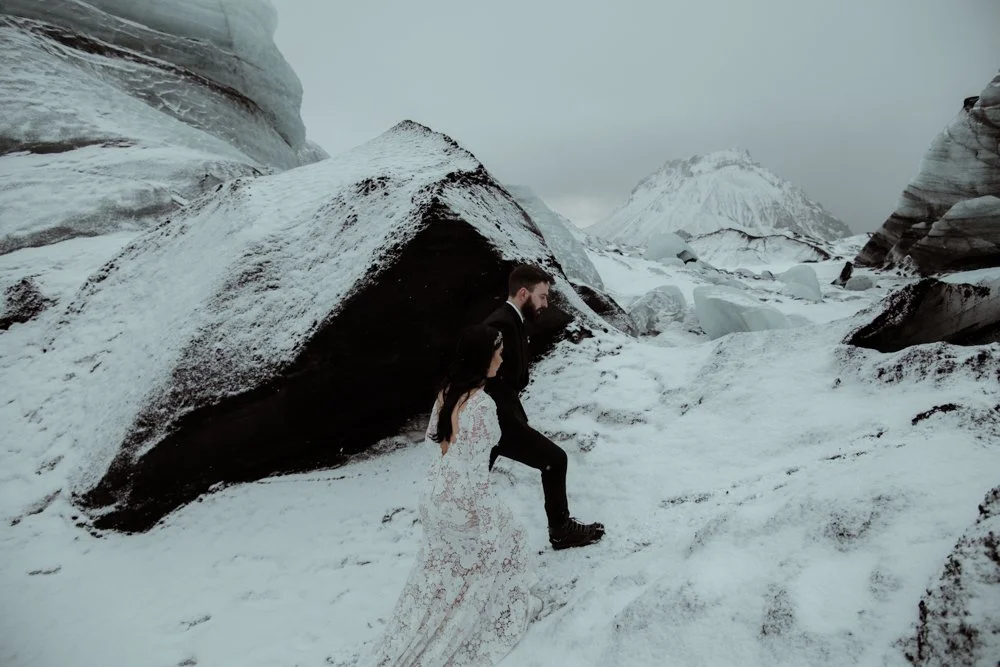 bride and groom on their wedding at katla ice cave in iceland