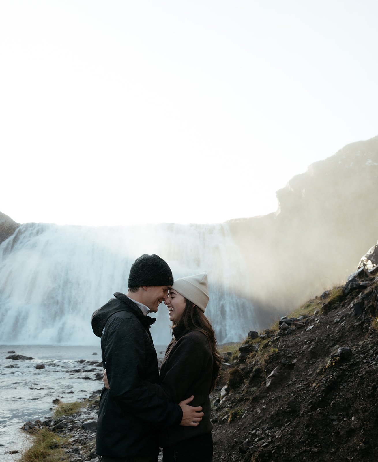 Newly engaged couple Tyler and Madison celebrating at Þórufoss waterfall in Iceland