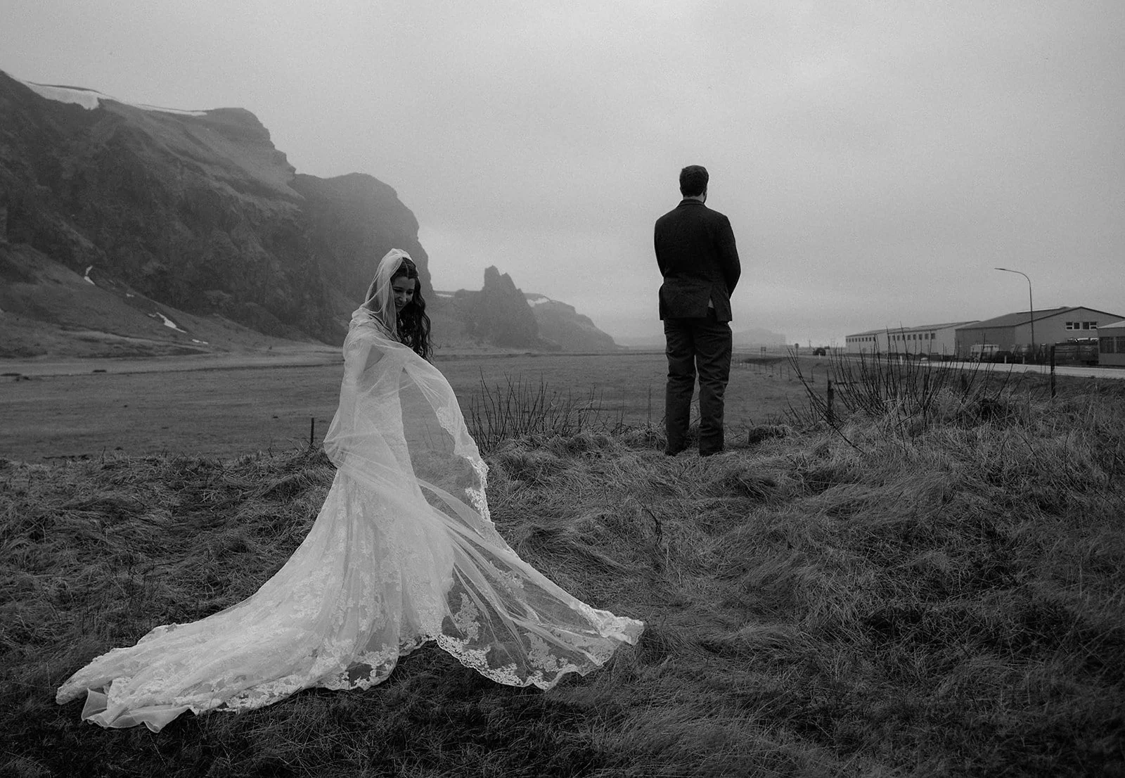Bride and groom enjoying a quiet moment during their Iceland elopement itinerary