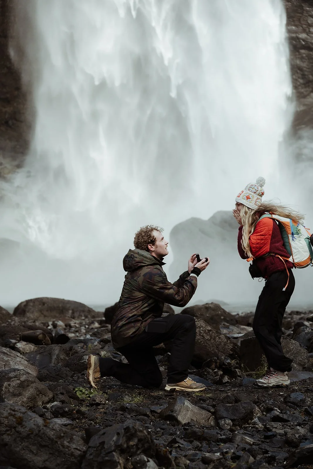 couple celebrating their engagement after a hiking proposal in Iceland