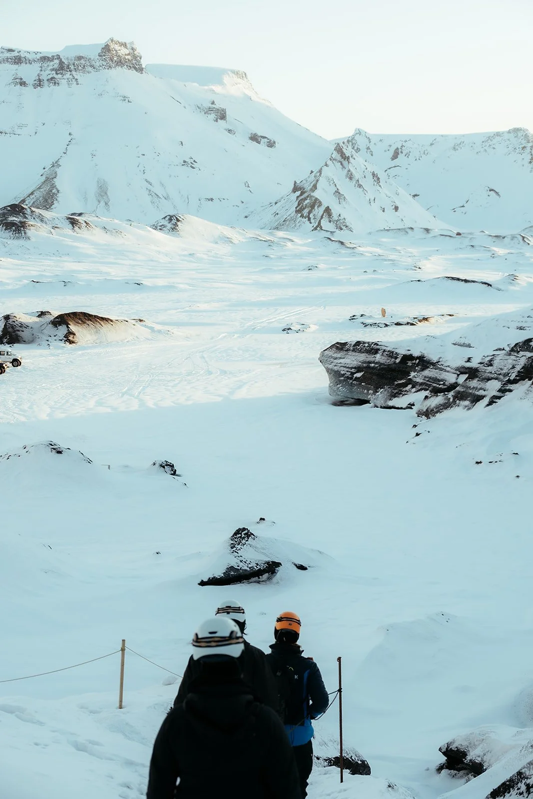 Couple wearing helmets and crampons during an Iceland ice cave proposal