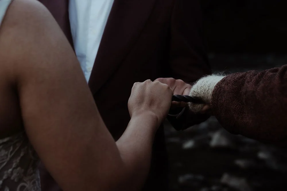 bride and groom getting married in front of Skogafoss waterfall