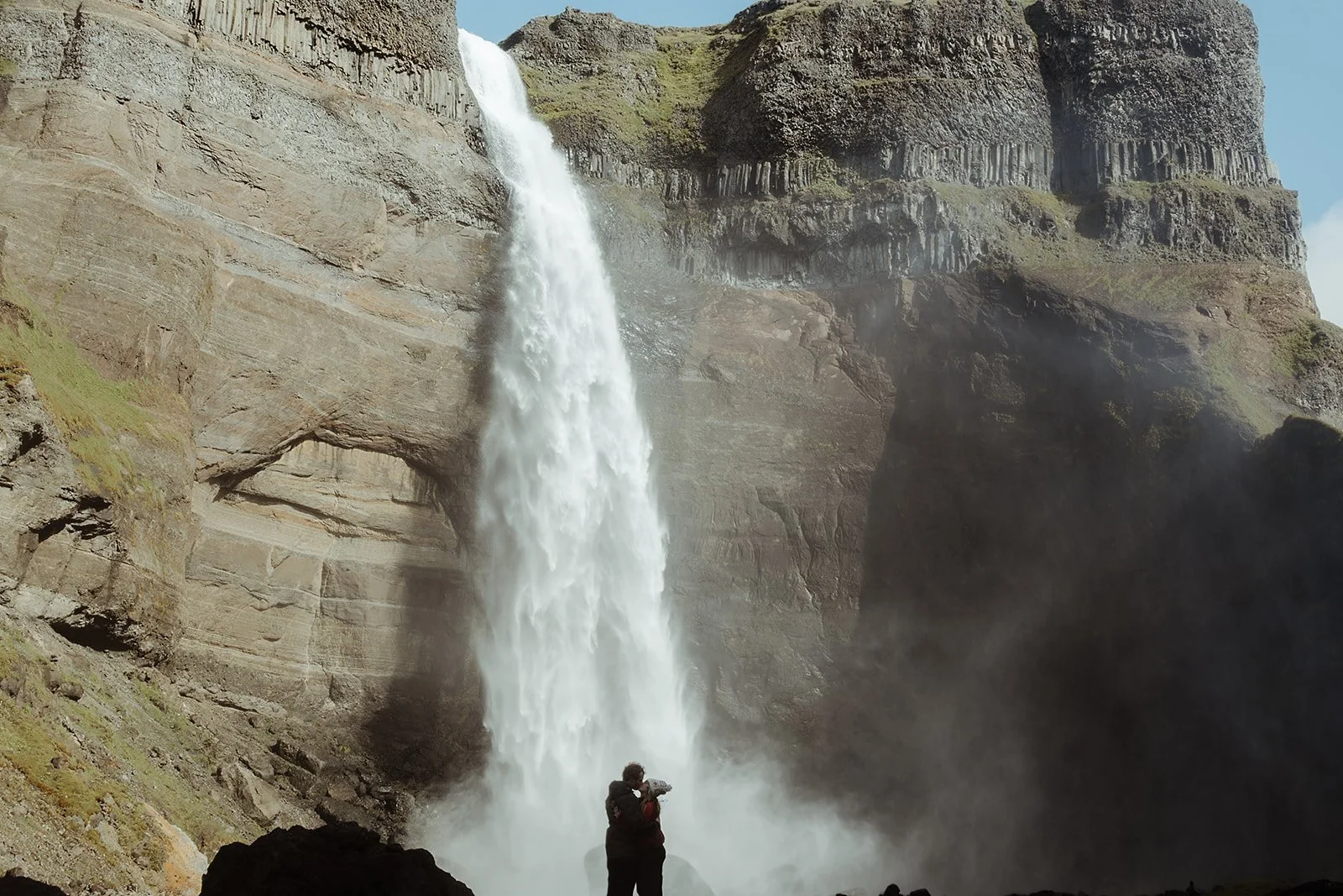 Iceland proposal couple exploring the Háifoss landscape after getting engaged