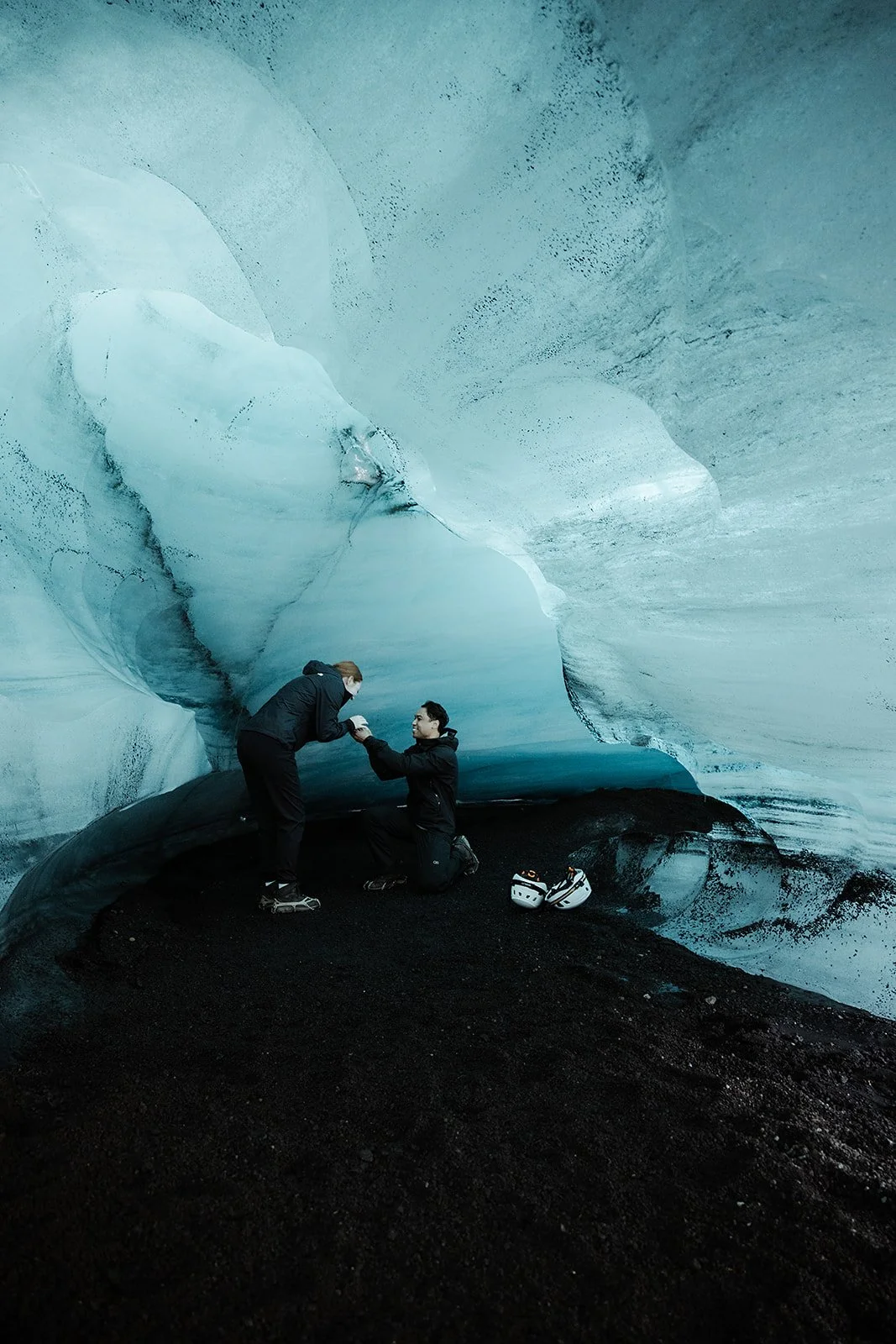 Vince getting down on one knee during their private Katla experience
